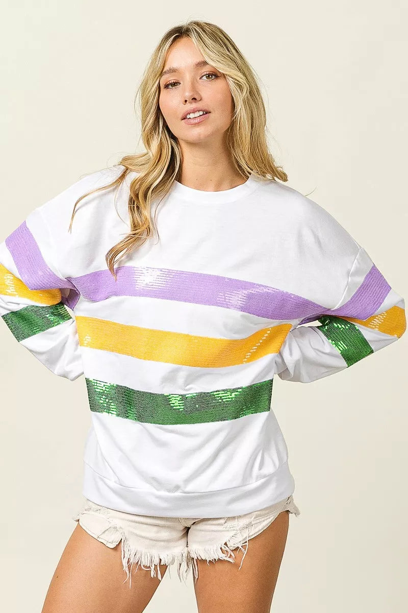 Sequin Mardi Gras striped round neck sweatshirt by Trendsi featuring colorful sequins and comfortable fit.