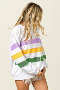 Sequin Mardi Gras striped round neck sweatshirt by Trendsi featuring colorful sequins and comfortable fit.