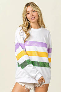 BiBi Sequin Mardi Gras striped round neck sweatshirt by Trendsi featuring colorful sequin stripes and a comfortable fit.