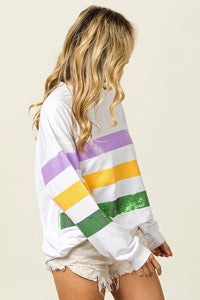 Sequin Mardi Gras striped round neck sweatshirt by Trendsi with vibrant sequin embellishments and comfortable fit.