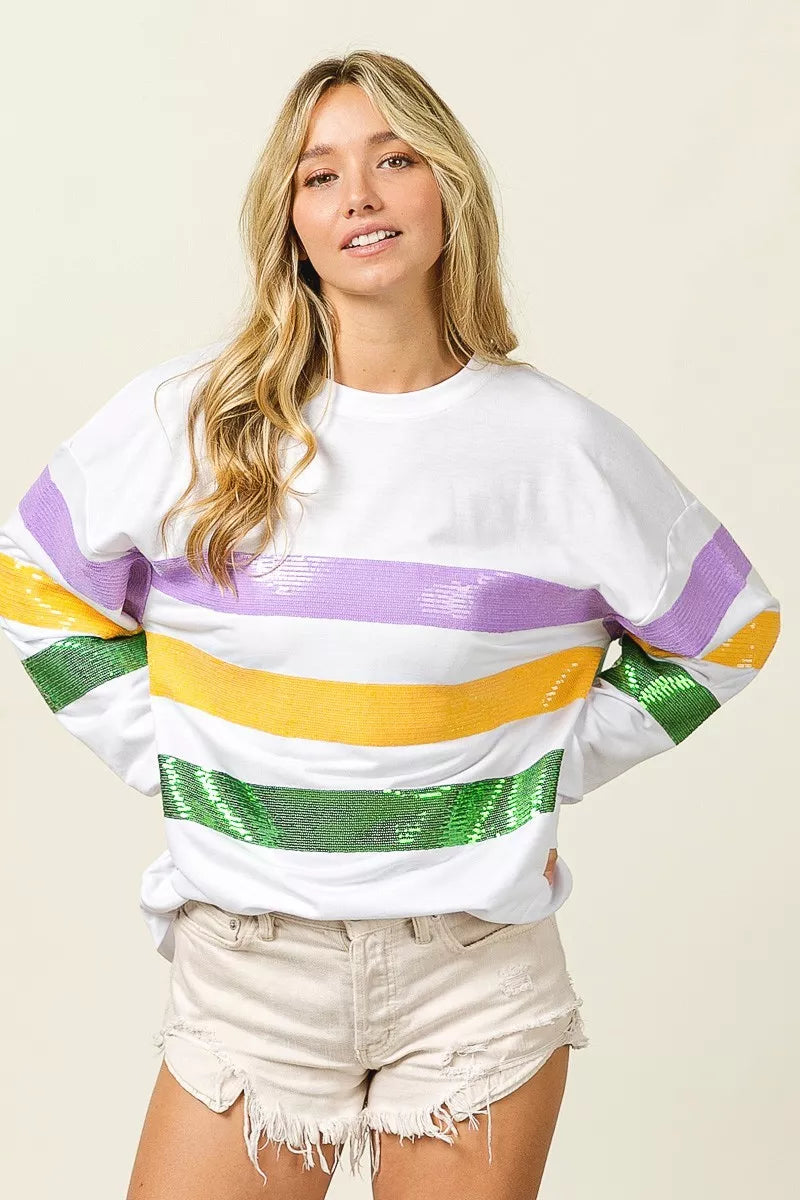 Sequin Mardi Gras striped round neck sweatshirt by Trendsi featuring colorful sequins and a casual fit.