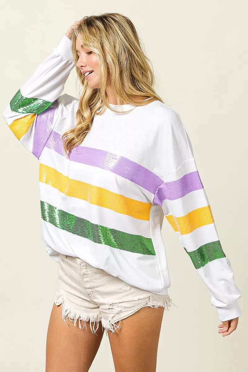 Sequin Mardi Gras striped round neck sweatshirt by Trendsi featuring colorful sequins and bold pattern on soft fabric.