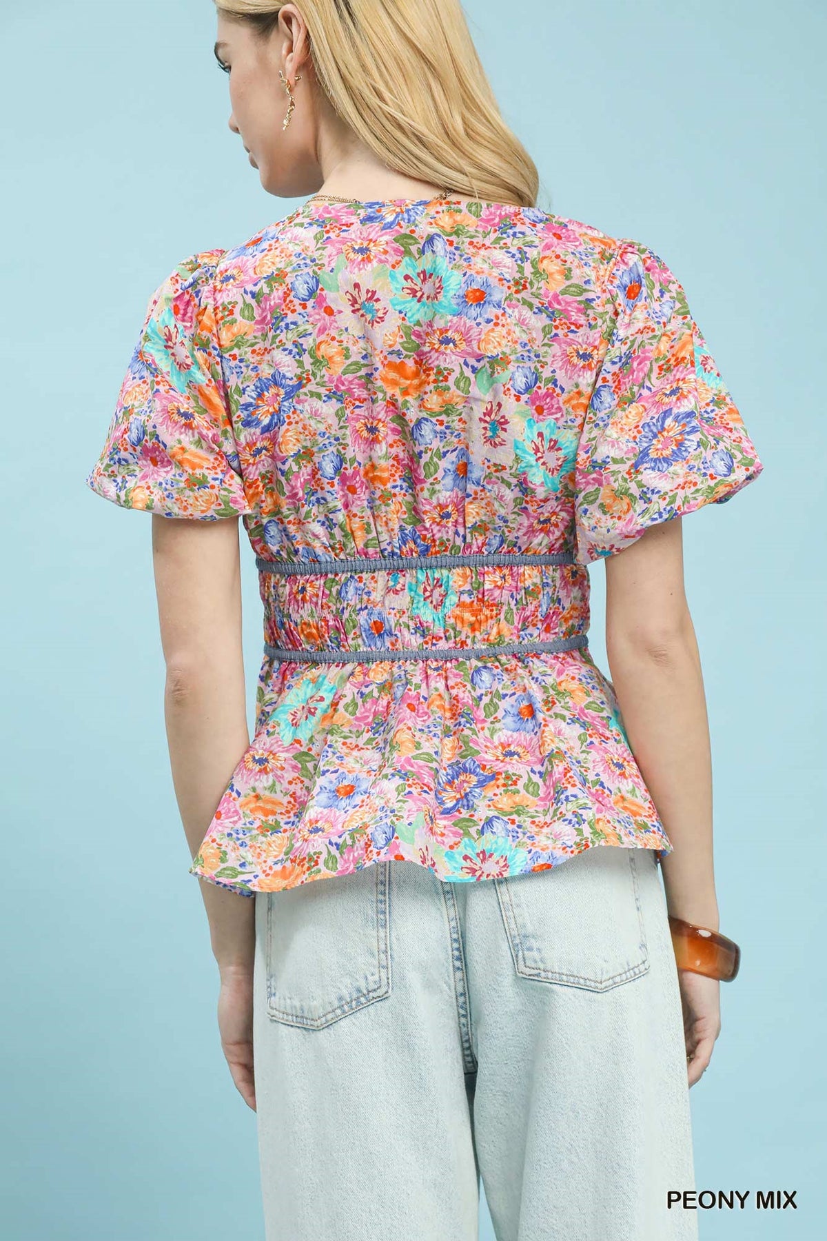 Umgee floral smocked waist blouse with mixed floral pattern and ruffled details, perfect for casual or boho style.