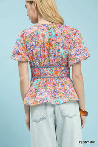 Umgee floral smocked waist blouse with mixed floral pattern and ruffled details, perfect for casual or boho style.