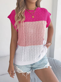 Pink Color Block Cable Knit Sweater by Trendsi featuring a cozy, chunky knit design and vibrant color blocking.