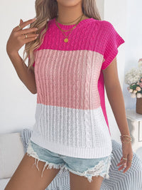 Pink color block cable knit sweater by Trendsi, featuring a cozy, chunky knit design and a stylish color block pattern.