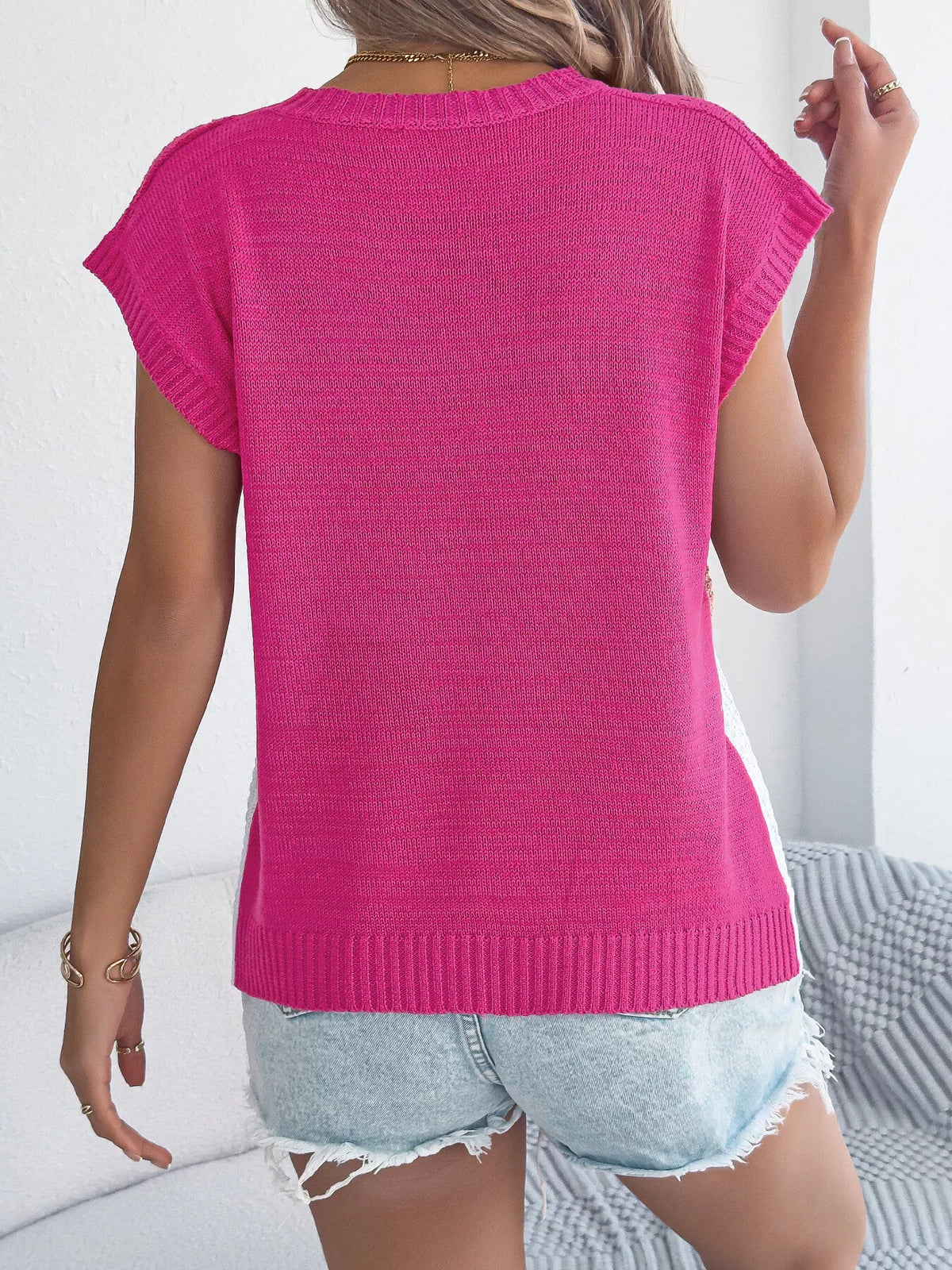 Pink color block cable knit sweater by Trendsi, showcasing a cozy, textured knit pattern with a stylish color block design.