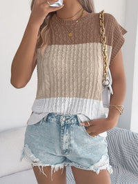 Pink color block cable knit sweater by Trendsi, featuring a cozy, chunky knit design and vibrant color blocking.