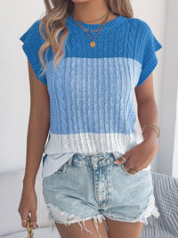 Pink color block cable knit sweater from Trendsi, featuring a cozy cable pattern and relaxed fit.