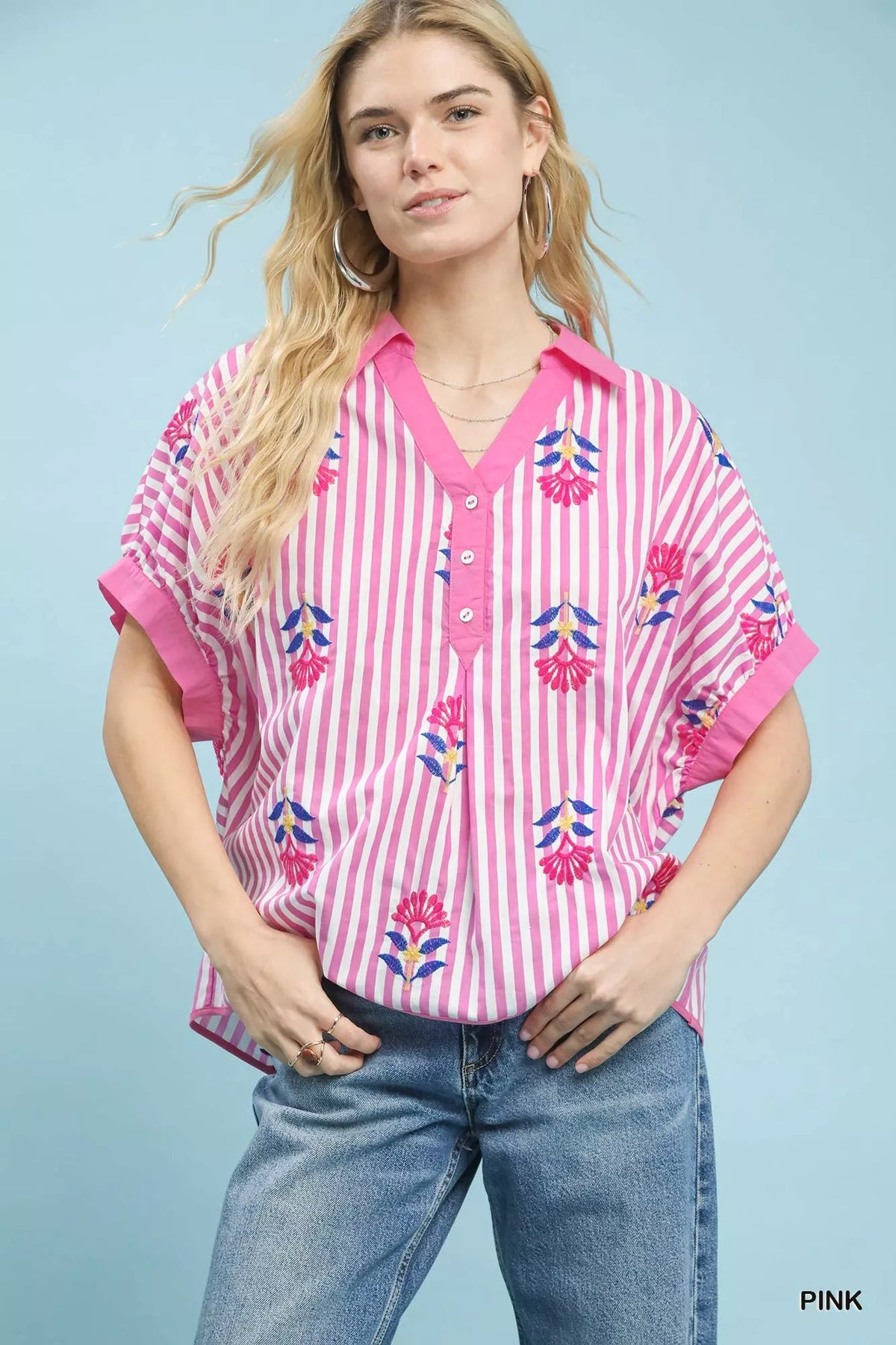 Umgee stripe embroidered boho blouse with button-front closure and relaxed fit, featuring colorful embroidery details.