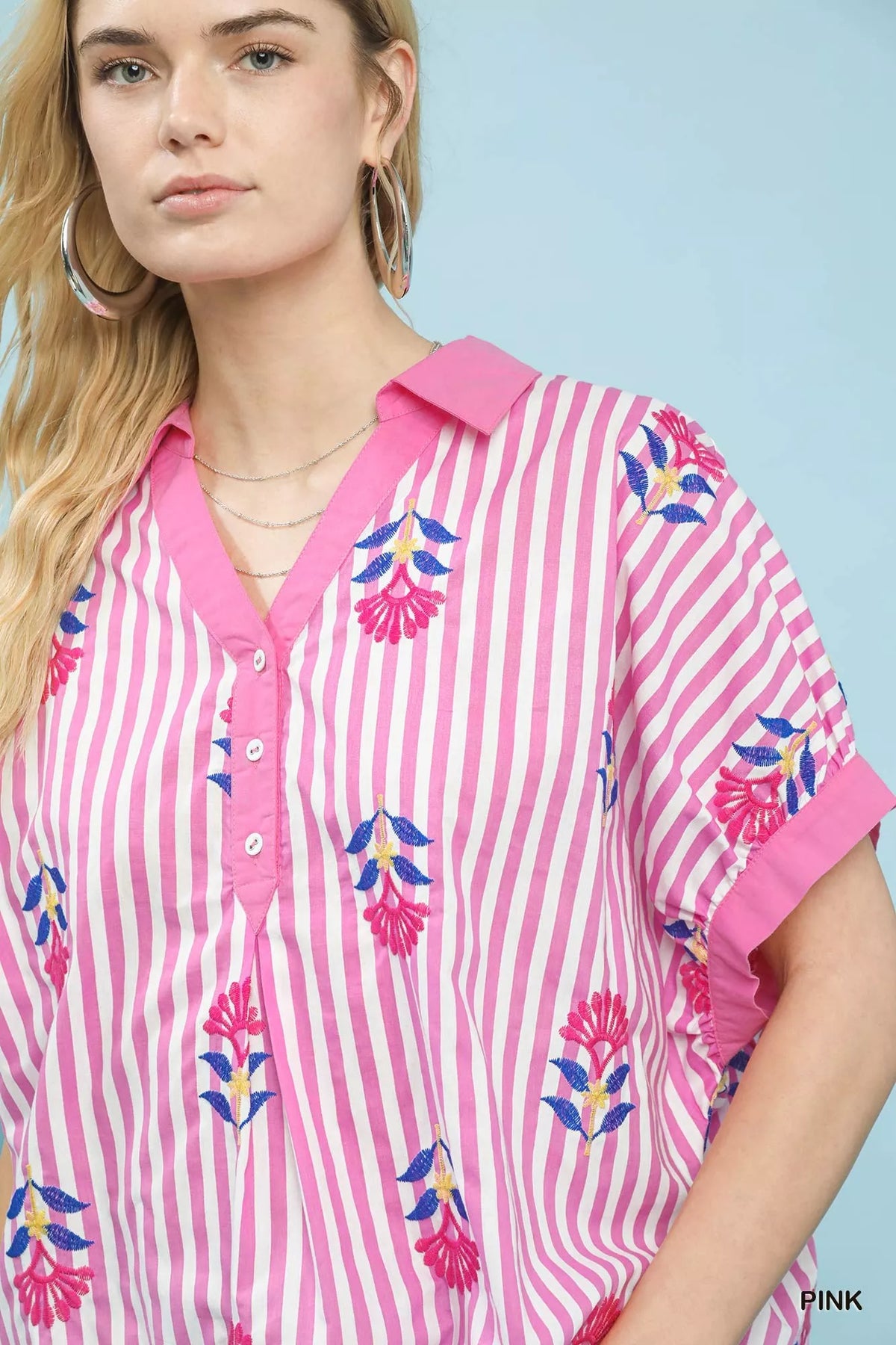 Umgee stripe embroidered boho blouse with button-front design, featuring colorful patterns and relaxed fit.