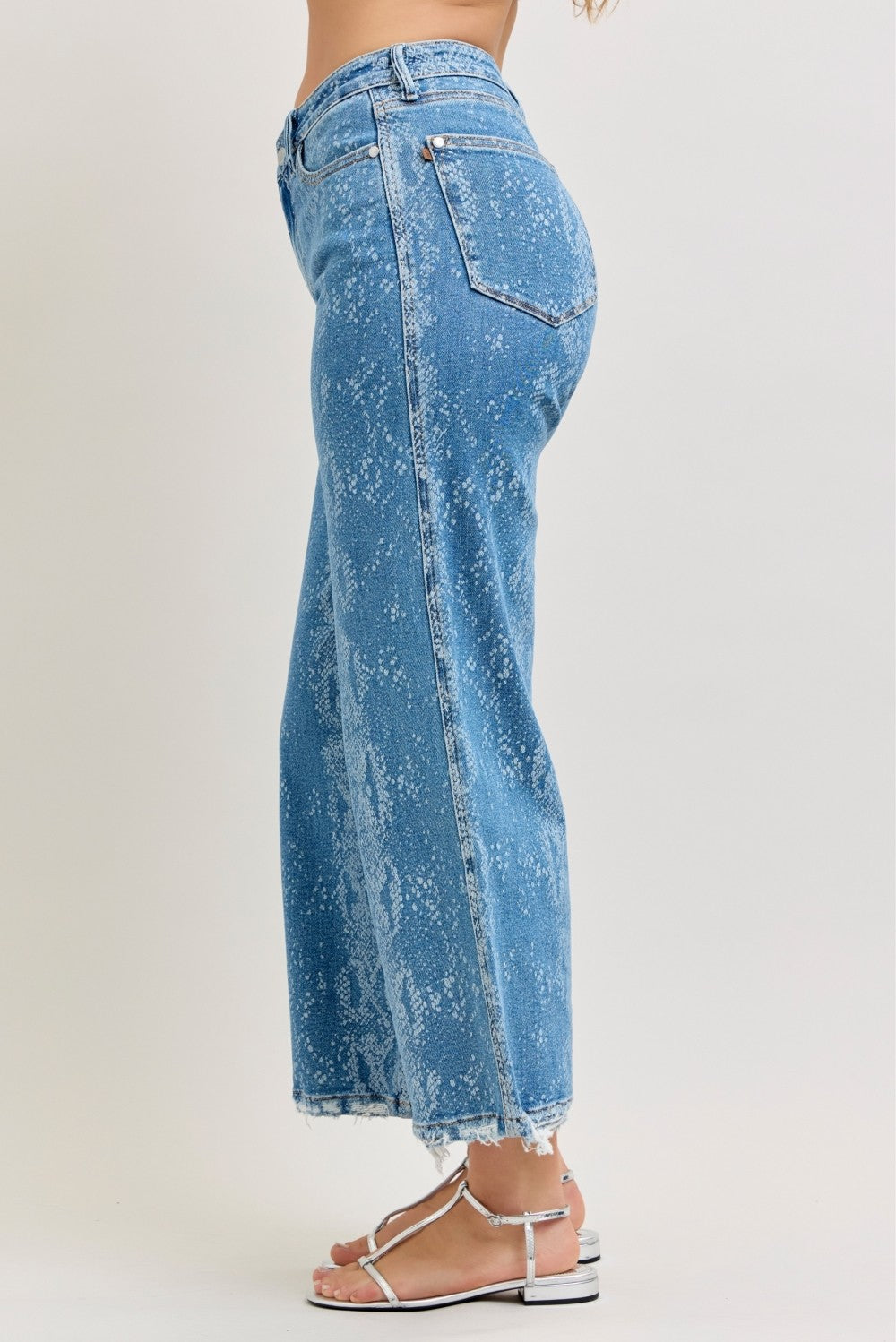 Judy Blue high-rise ankle wide-leg jeans with distressed details and classic denim wash, styled on a model.