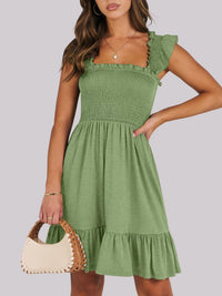 Sage green smocked ruffle hem mini dress by Trendsi, featuring a fitted bodice, ruffled hem, and stylish mini length.