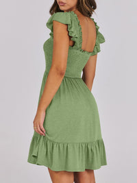 Sage green smocked ruffle hem mini dress by Trendsi, featuring a fitted bodice, ruffled hem, and adjustable straps.