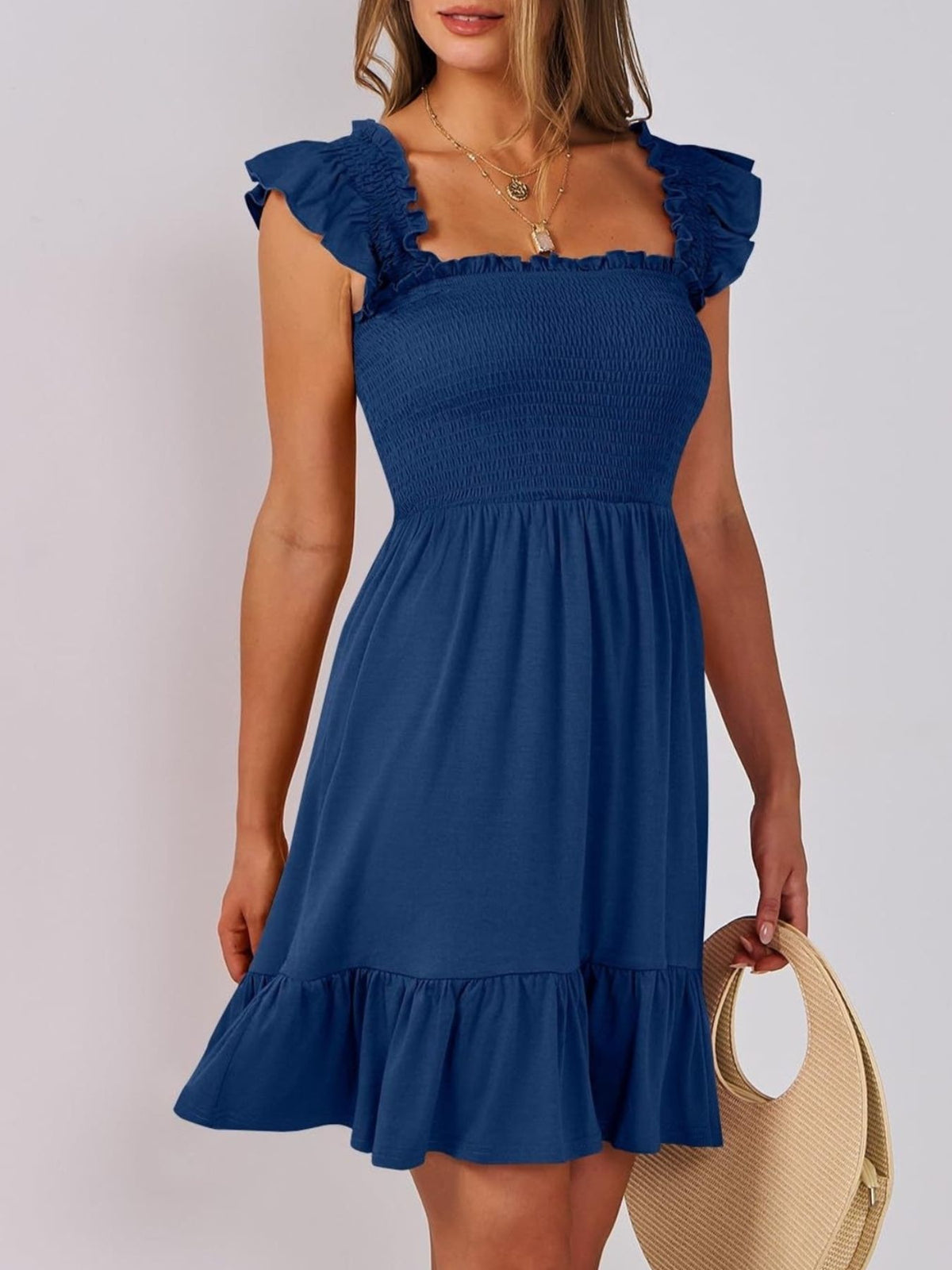 Sage green smocked ruffle hem mini dress by Trendsi, featuring a fitted bodice and playful ruffle details, perfect for warm-weather wear.