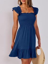 Sage green smocked ruffle hem mini dress by Trendsi, featuring a fitted bodice and playful ruffle details, perfect for warm-weather wear.