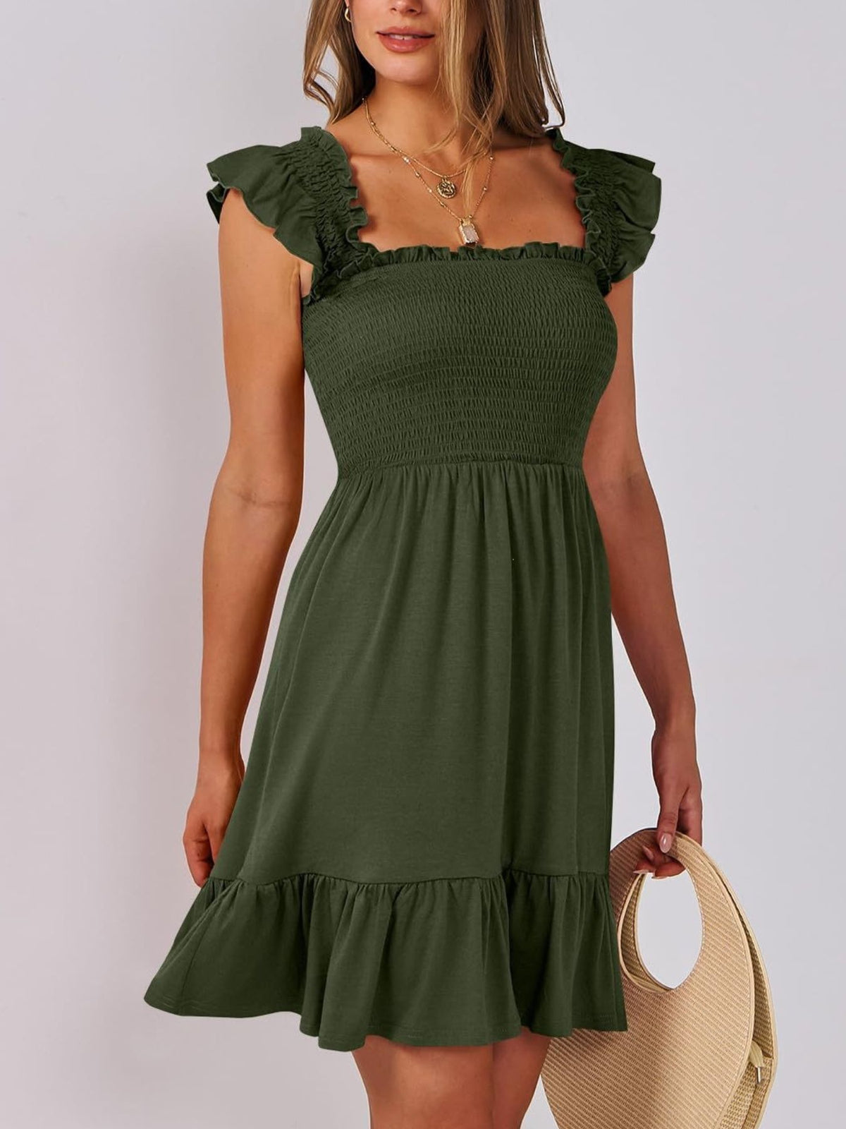 Sage green smocked ruffle hem mini dress by Trendsi, featuring a fitted bodice and playful ruffle details at the hem.