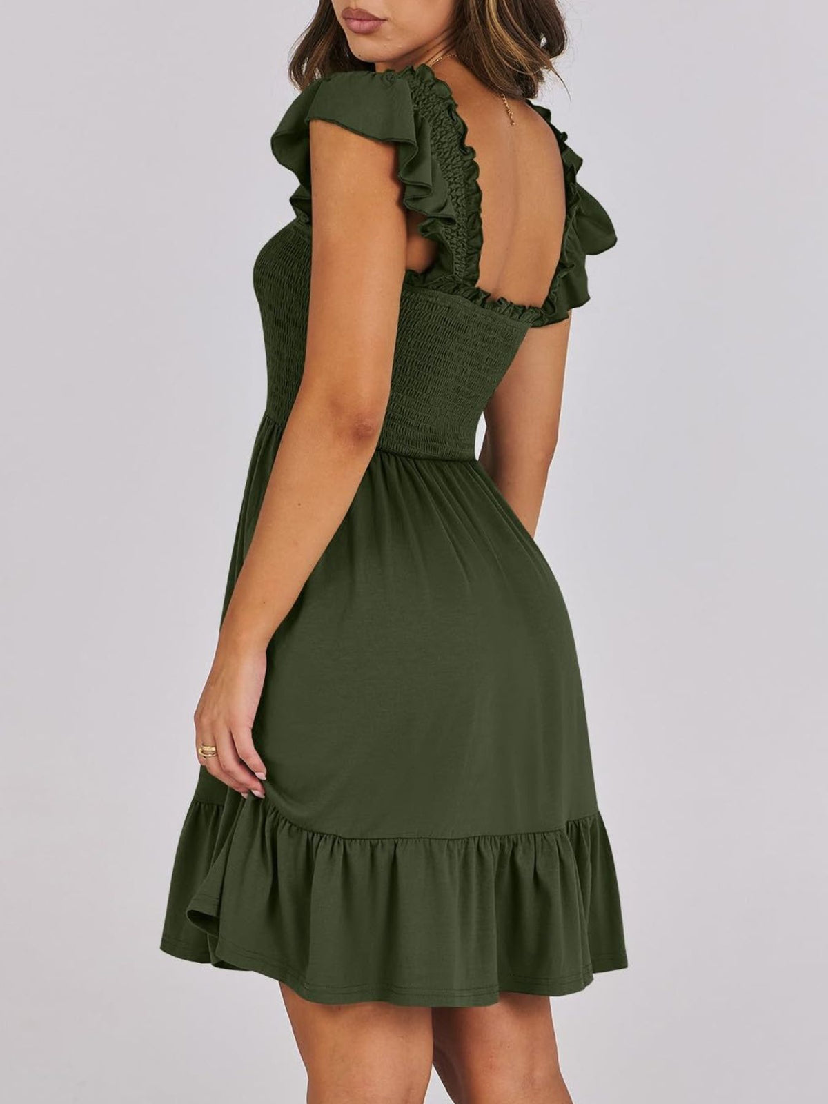 Sage green smocked ruffle hem mini dress by Trendsi featuring a fitted bodice and playful ruffled hem, perfect for warm weather.