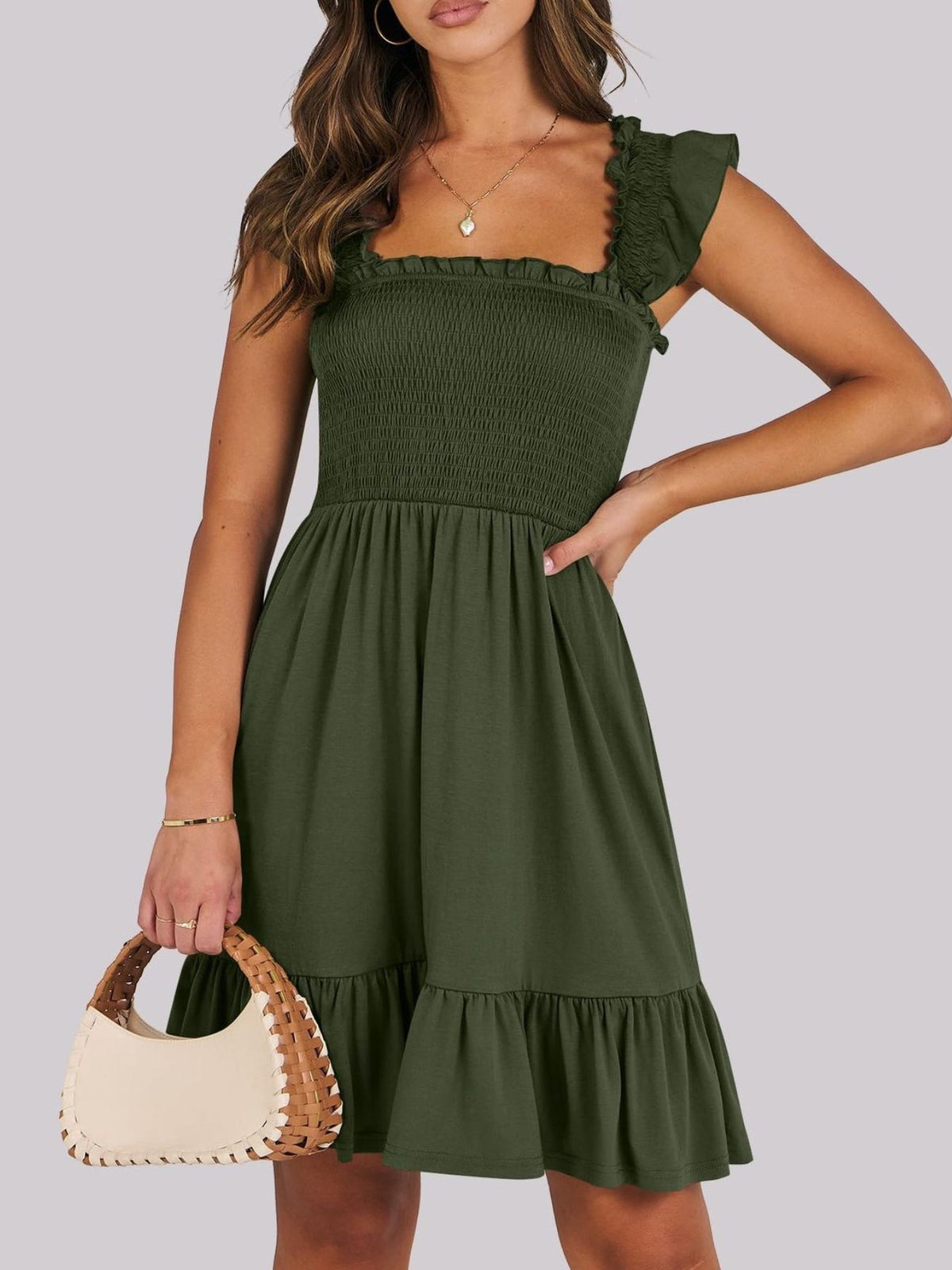Sage green smocked ruffle hem mini dress by Trendsi, featuring a fitted bodice and playful ruffle details.