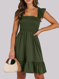 Sage green smocked ruffle hem mini dress by Trendsi, featuring a fitted bodice and playful ruffle details.