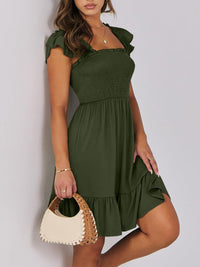Sage green smocked mini dress with ruffle hem by Trendsi, featuring a fitted bodice and flowy skirt for a stylish look.