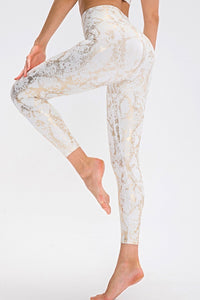 Animal print slim fit long sports pants with wide waistband, designed for comfort and style in activewear.