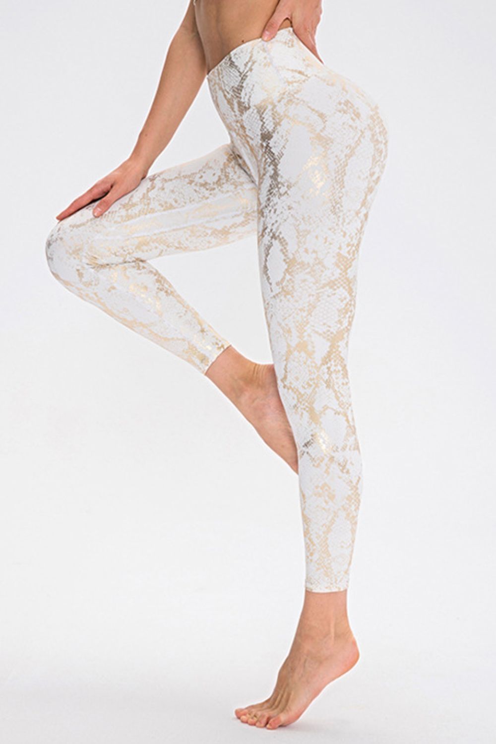 Animal print slim fit long sports pants with wide waistband from Trendsi, showing detail of the patterned fabric and athletic style.