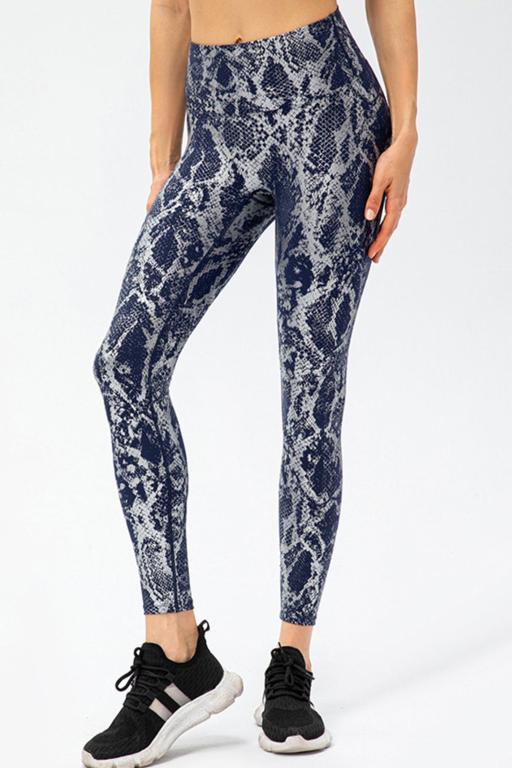 Animal print slim fit sports pants with wide waistband, long style, by Trendsi, featuring bold animal pattern and comfortable athletic wear