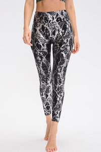Animal print slim fit sports pants with wide waistband, designed for activewear and casual wear by Trendsi.