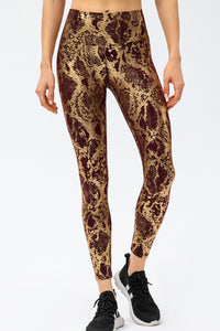 Animal print slim fit sports pants with wide waistband, designed for comfortable, stylish long workout or casual wear by Trendsi