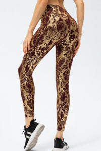 Animal print slim fit sports pants with wide waistband, long design, by Trendsi, shown in the image.