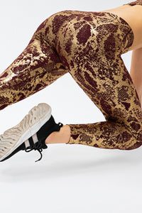Animal print slim fit sports pants with wide waistband, designed for active wear, by Trendsi.