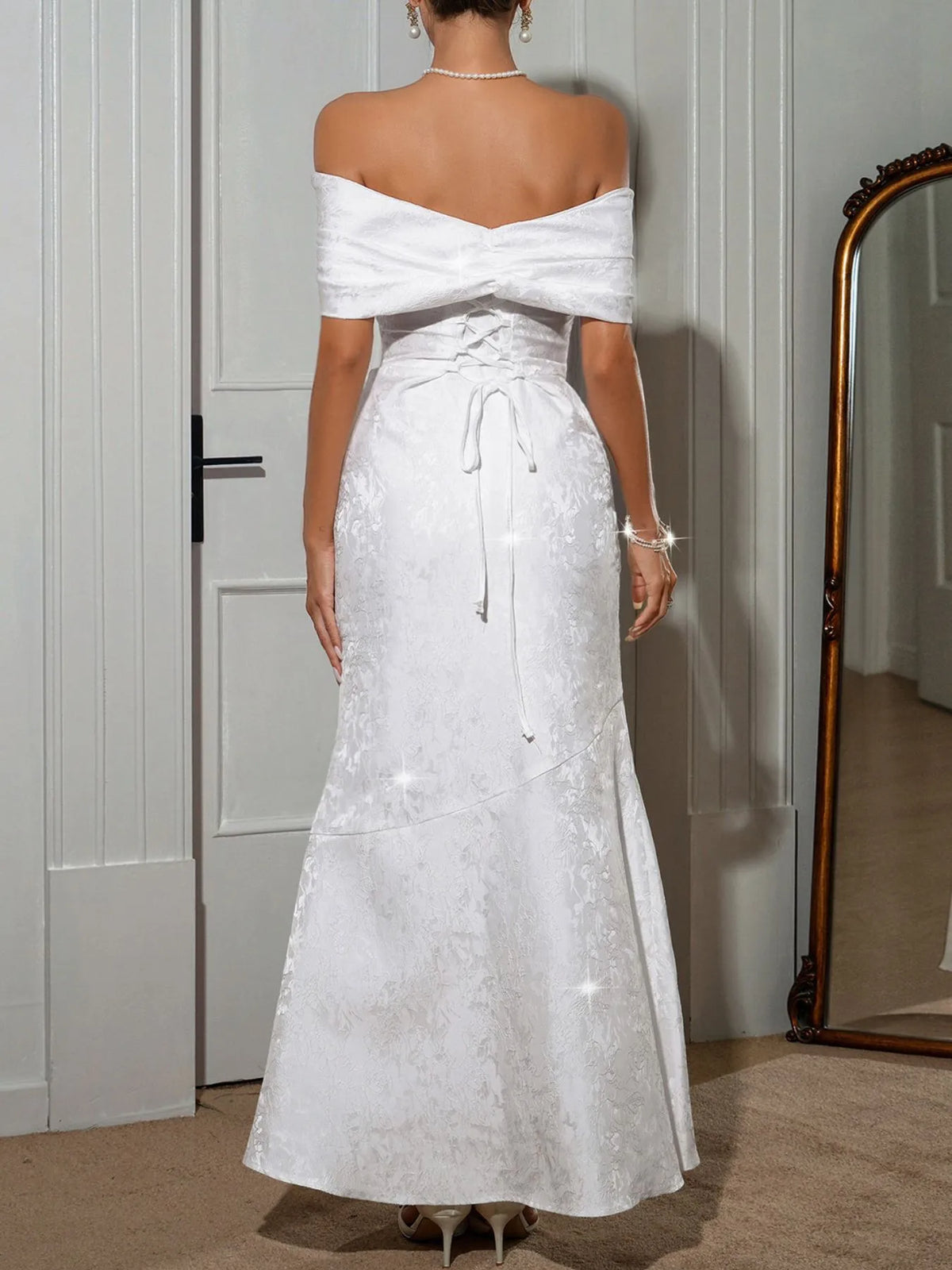 Off-shoulder maxi dress by Trendsi featuring a flowy silhouette and elegant design, perfect for summer or special occasions.