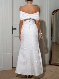 Off-shoulder maxi dress by Trendsi featuring a flowy silhouette and elegant design, perfect for summer or special occasions.