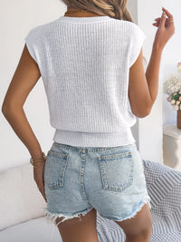 White cable knit cap sleeve sweater by Trendsi featuring a classic knit pattern and a cozy, stylish design.