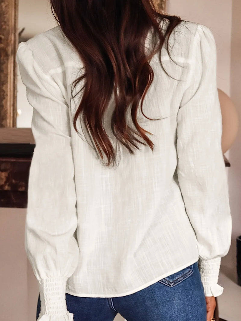Embroidered long sleeve blouse from Trendsi featuring intricate embroidery, lightweight fabric, and a relaxed fit.