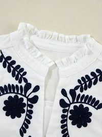Embroidered long sleeve blouse from Trendsi featuring intricate embroidery, lightweight fabric, and a relaxed fit.