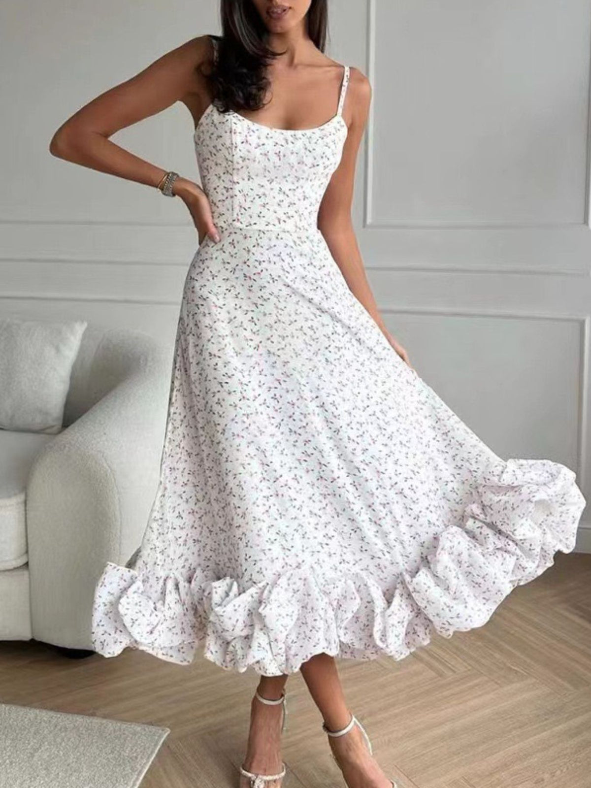 Floral print ruffle hem spaghetti strap midi dress by Trendsi, featuring a fitted bodice and flowing skirt with vibrant floral pattern.