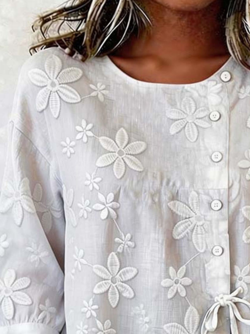 Plus size white floral embroidered button-down shirt by Trendsi, detailed floral embroidery on classic long-sleeve blouse