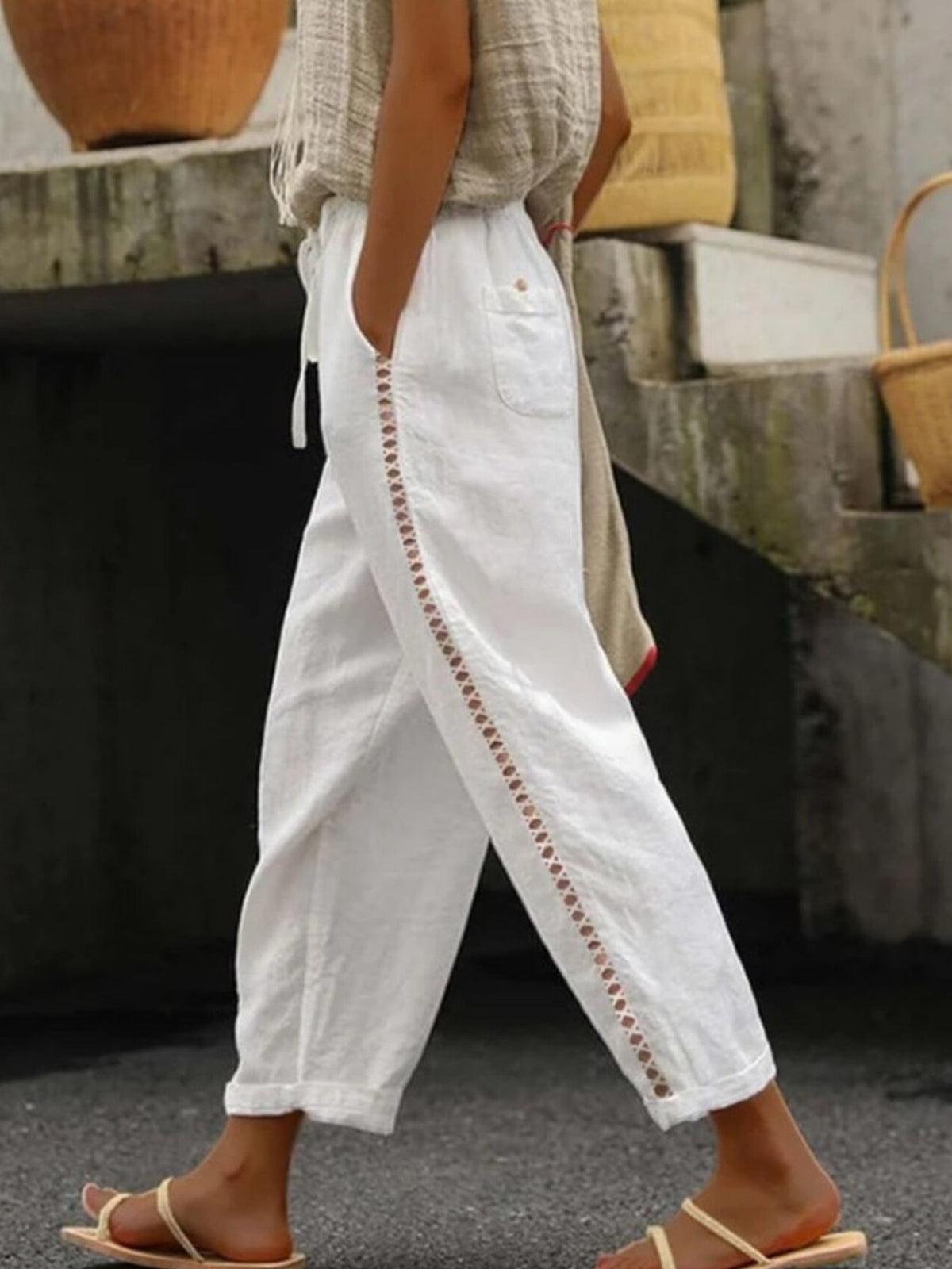 Trendsi hollow out trim cropped pants showing stylish cut-out details and tapered fit in a neutral fabric.