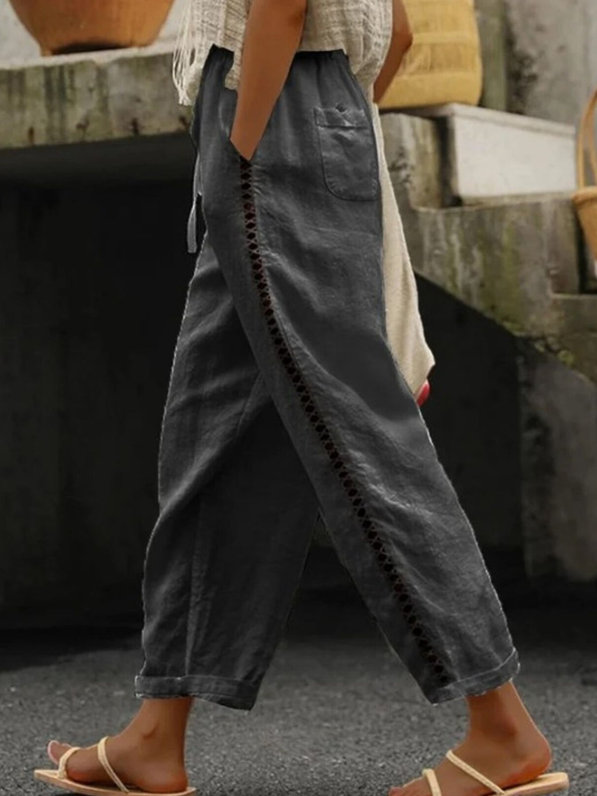 Hollow out trim cropped pants from Trendsi featuring stylish cut-out details and a modern, fitted design.