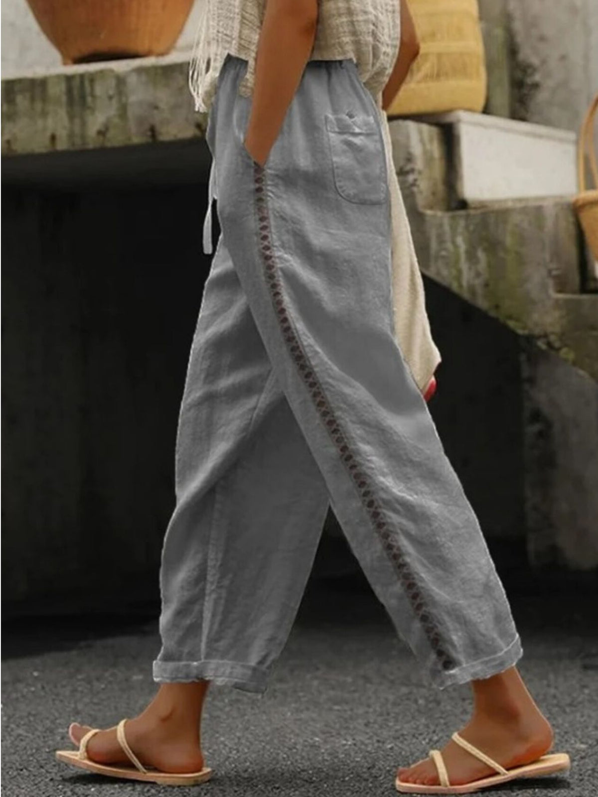 Hollow out trim cropped pants in black from Trendsi, featuring a stylish cut-out design and high-waisted fit.