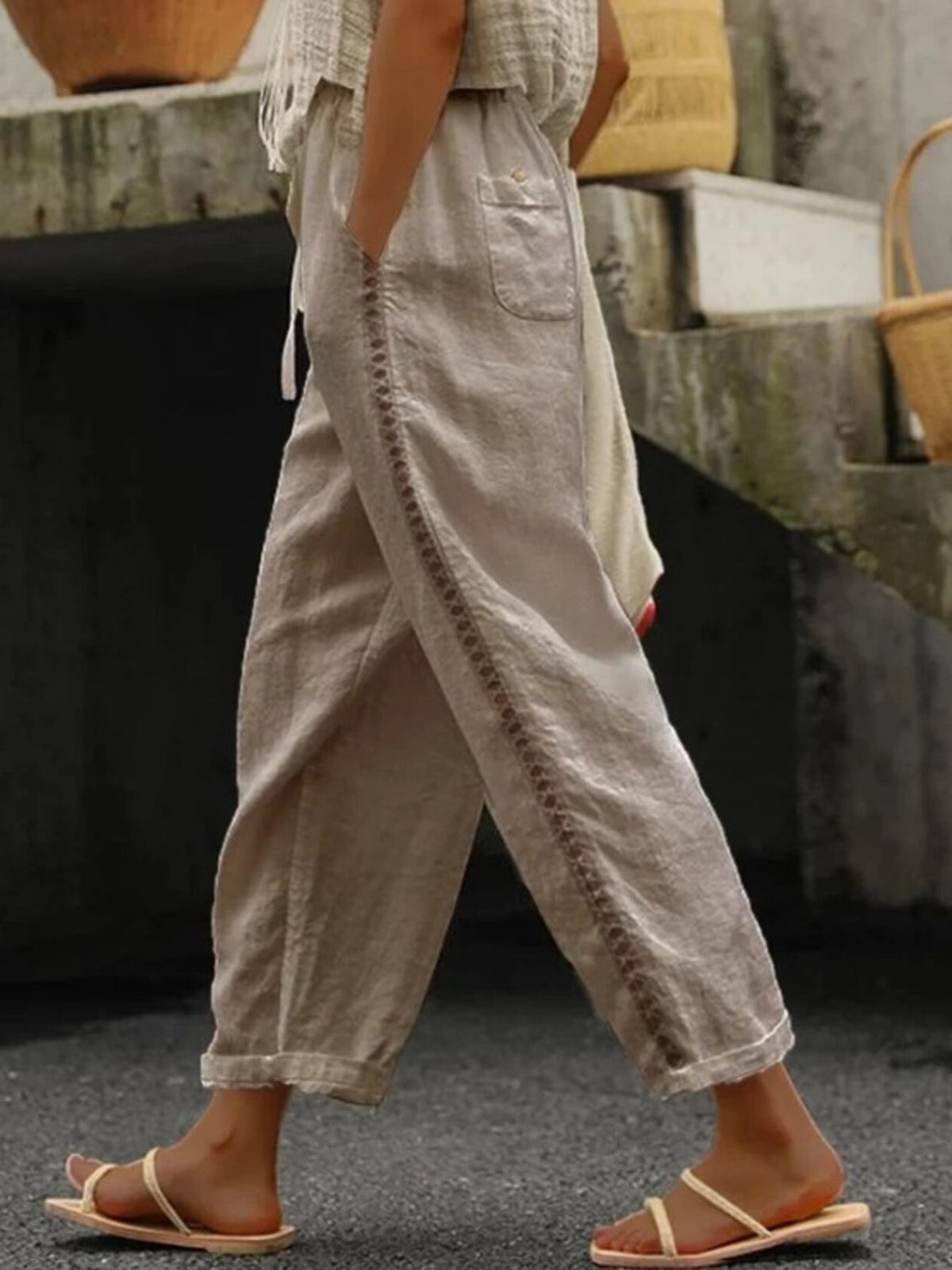 Hollow out trim cropped pants from Trendsi featuring a stylish cut-out design and a relaxed fit, perfect for casual wear.
