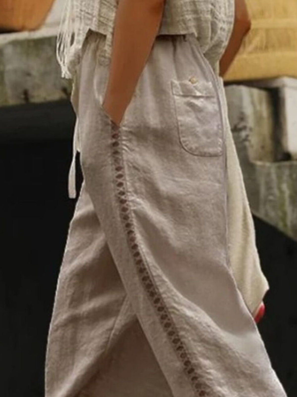 Hollow out trim cropped pants from Trendsi showing a stylish, lightweight design with a cut-out detail at the hem.