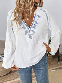 Paisley pattern notched long sleeve blouse by Trendsi, featuring a stylish design with a notched collar and long sleeves.