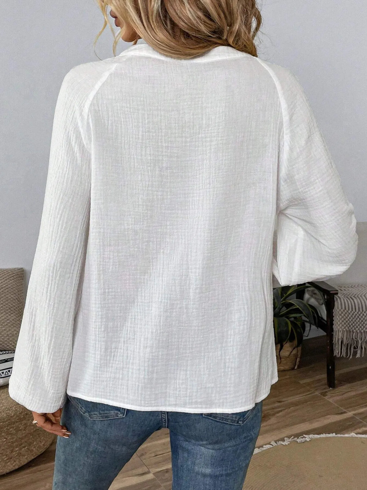 Paisley pattern notched long sleeve blouse from Trendsi, featuring a stylish design with a relaxed fit and elegant details.