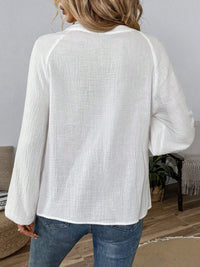Paisley pattern notched long sleeve blouse from Trendsi, featuring a stylish design with a relaxed fit and elegant details.