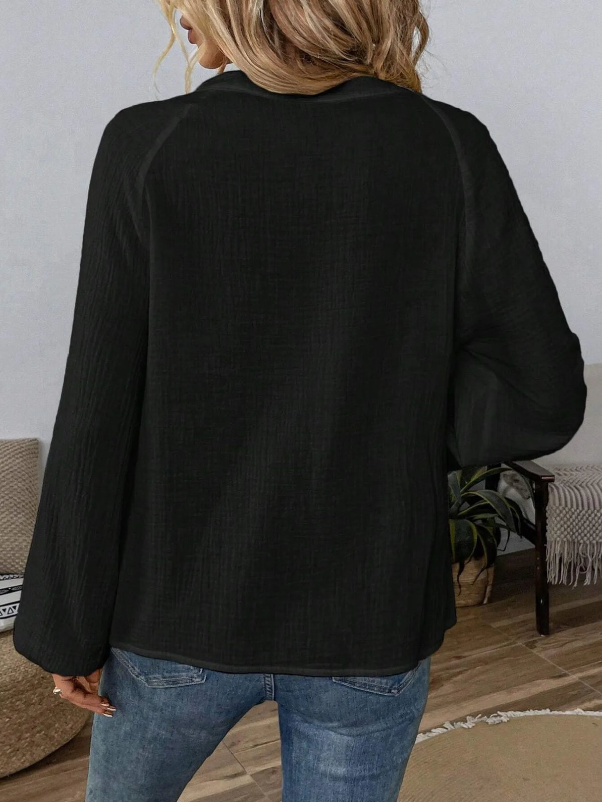 Paisley pattern notched long sleeve blouse from Trendsi featuring a stylish design and feminine fit, displayed on a hanger.