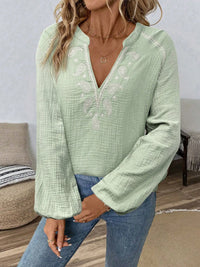 Paisley pattern notched long sleeve blouse by Trendsi, featuring a stylish design with a relaxed fit and elegant details.
