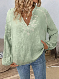 Long sleeve blouse with paisley pattern and notched neckline from Trendsi, featuring a stylish, flowing design.
